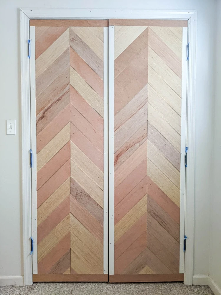 https://www.lovelyetc.com/wp-content/uploads/2021/02/chevron-wood-plank-door-before-painting.webp