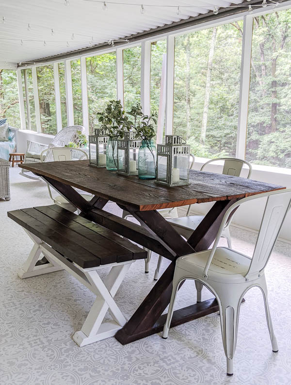 DIY wood farmhouse table and bench made from inexpensive lumber.