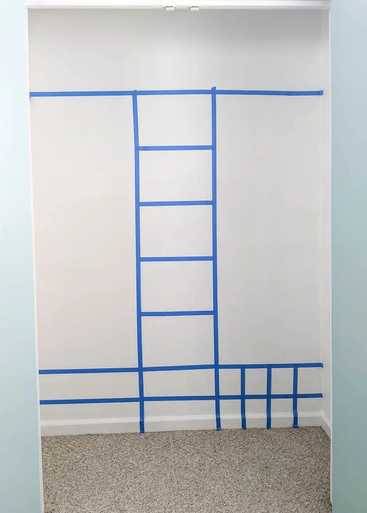 https://www.lovelyetc.com/wp-content/uploads/2021/03/using-painters-tape-to-plan-diy-closet-organizer.webp