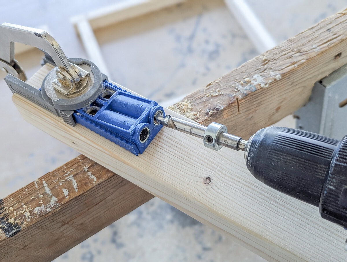 using a kreg jig to drill pocket holes.