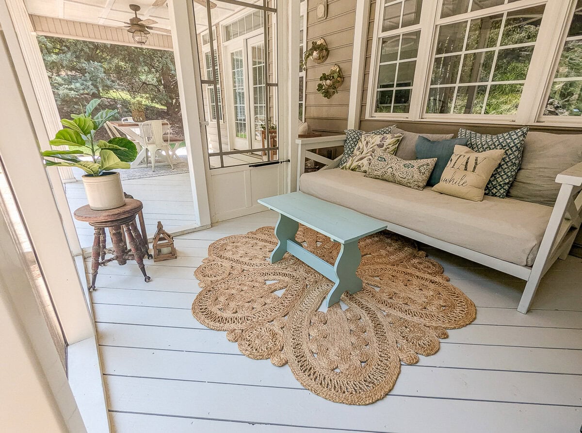 boho farmhouse screened porch full of vintage finds.