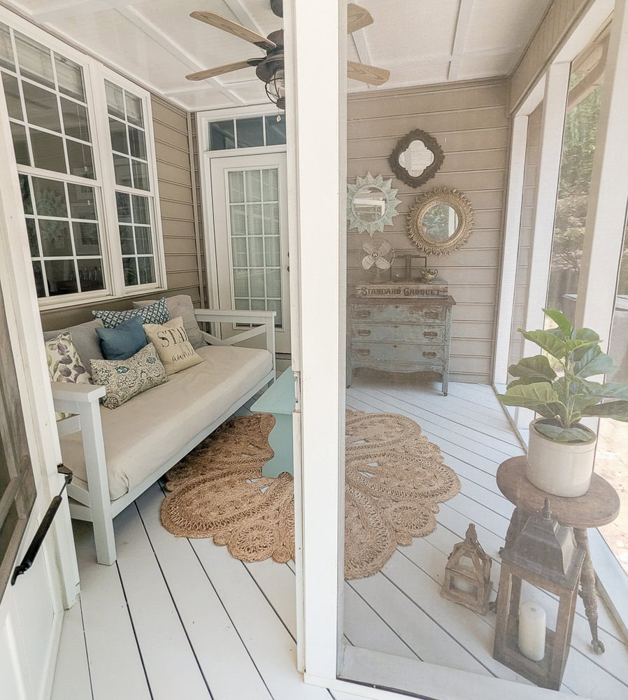 screened porch with cozy boho farmhouse decor.